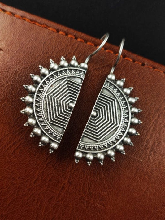 Shop Me19’s Antique Silver Sunburst Earrings with intricate geometric etching and a bold handcrafted finish. Perfect for ethnic, festive, or boho looks